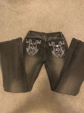 Rhinestone skull embroidered flare jeans